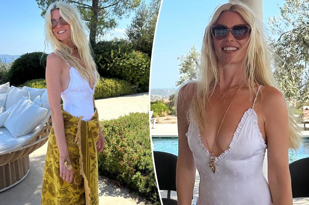 Claudia Schiffer, 55, relaxes by the pool in a low-cut Chloe swimsuit