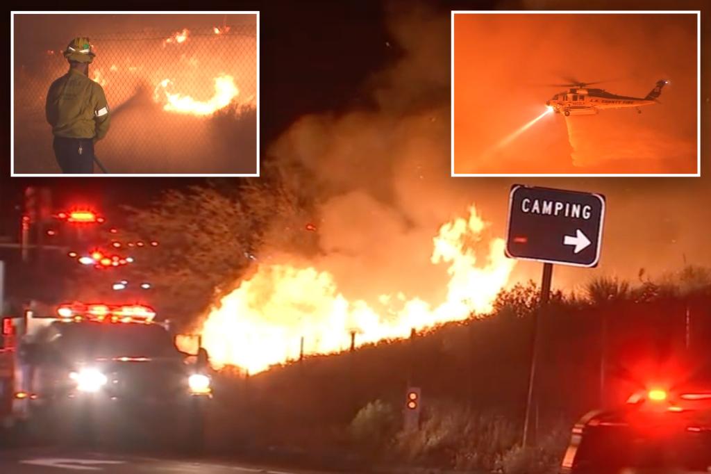 Firefighters achieve advancements in battling rapidly spreading fire near highway north of Los Angeles