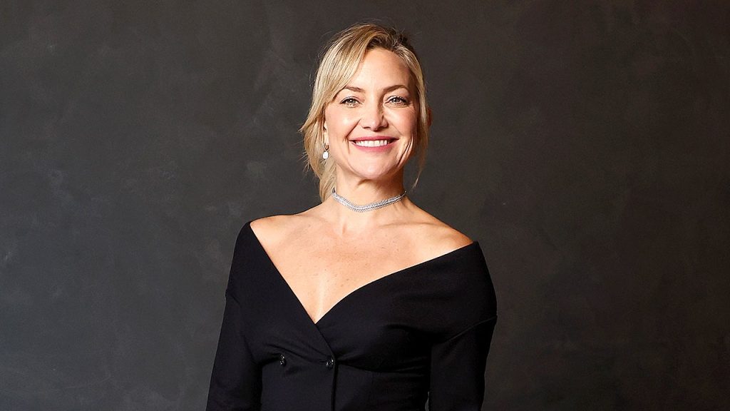 Kate Hudson displays her fit abs in a blue bikini on Instagram.