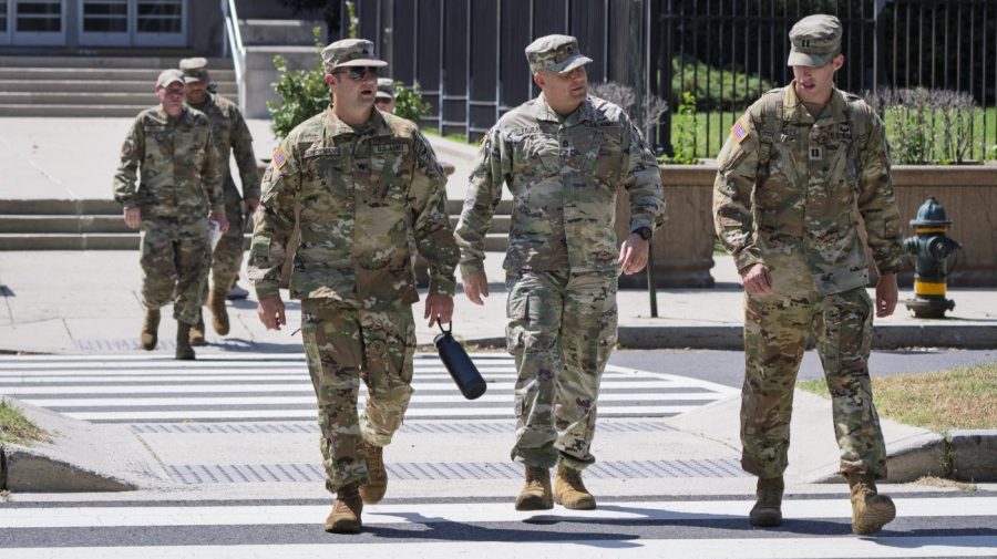 National Guard soldiers are seen in DC as part of Trump's display of strength.