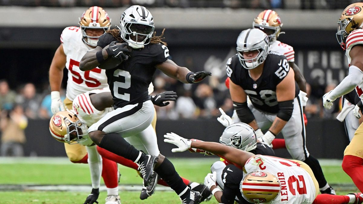 Raiders' Ashton Jeanty tackles a 49ers defender