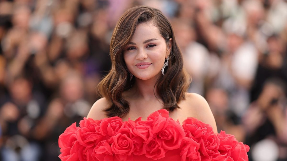 Selena Gomez models a pink satin lingerie set