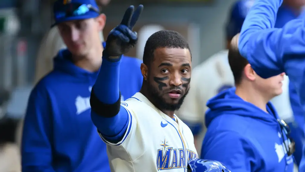Victor Robles of the Mariners throws his bat at the pitcher