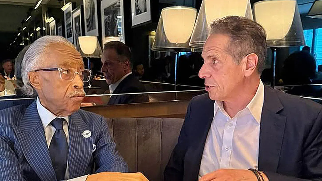 Andrew Cuomo discusses with Al Sharpton during the New York City mayoral race