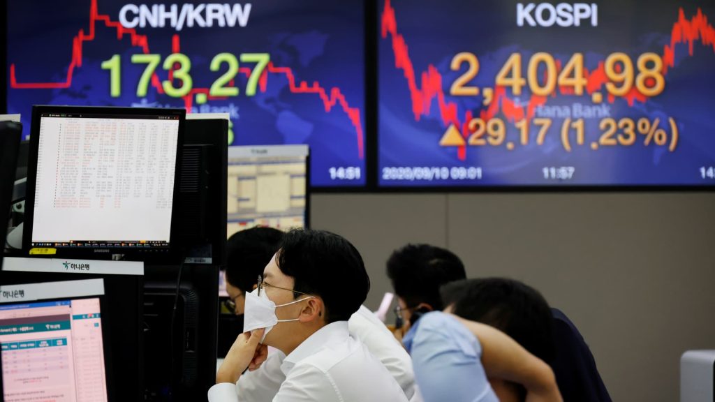 Asian markets start off uneven as investors monitor U.S.-China discussions in Spain.