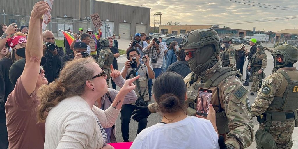 Democratic candidates among the progressive group obstructing road outside ICE facility.