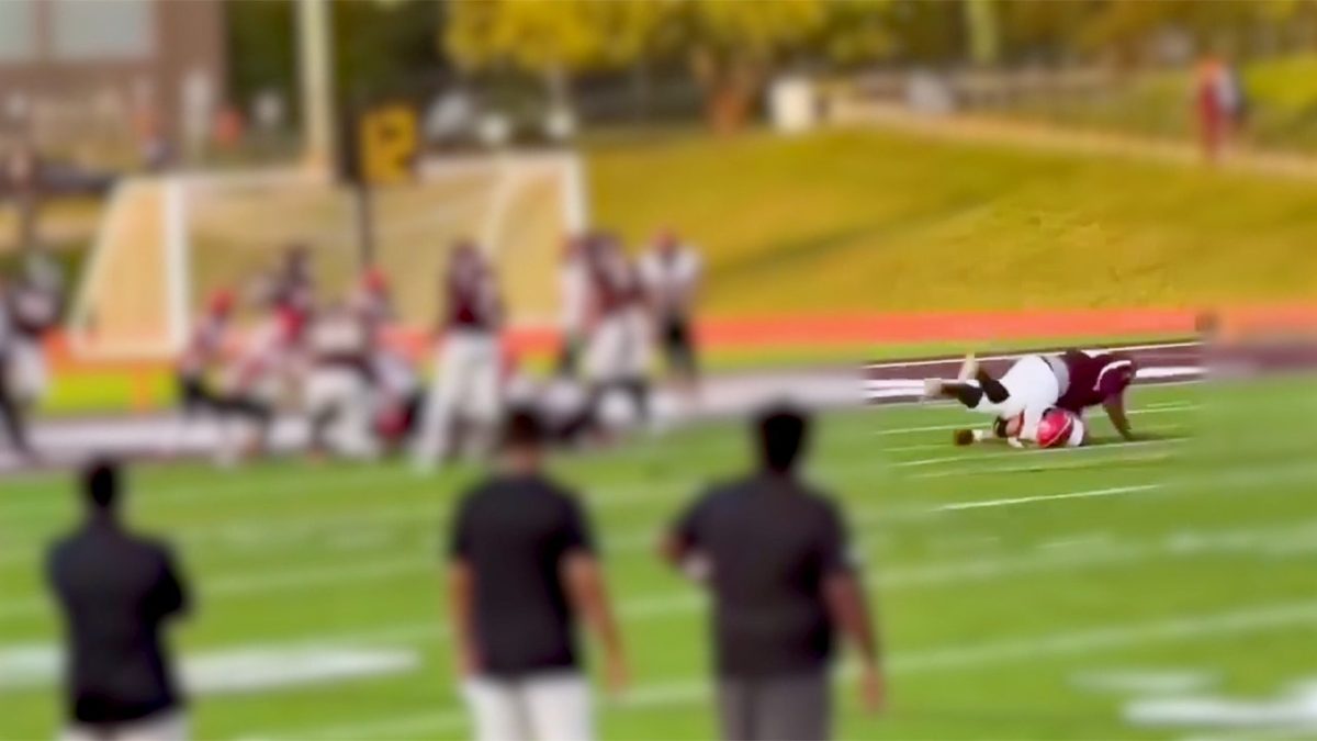 High school football player hurt in a body slam goes to the game in a wheelchair