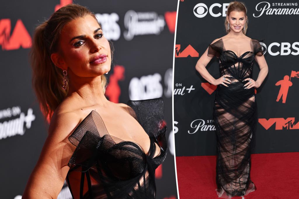 Jessica Simpson walks the red carpet at the 2025 VMAs in a tulle dress