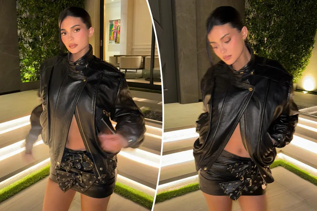 Kylie Jenner dons a leather miniskirt that appears to be made of belts.