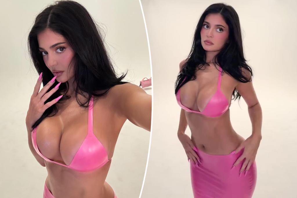 Kylie Jenner shows off her curves in a bright pink latex outfit