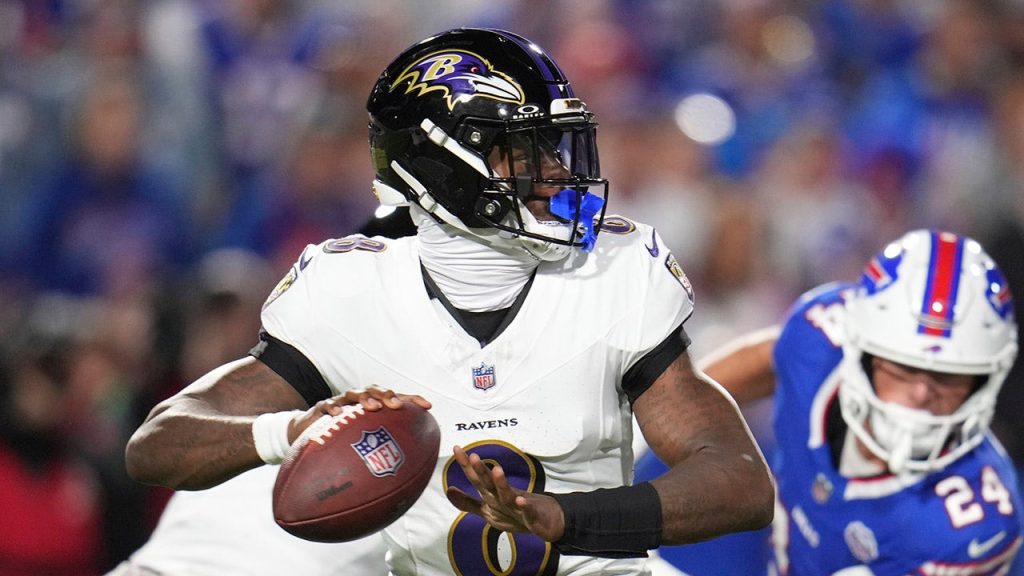 Lamar Jackson responds after a fan hits him in the helmet