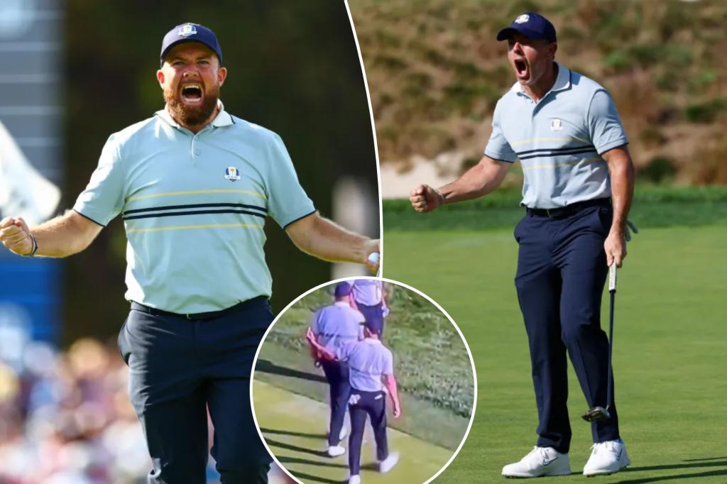 Shane Lowry and Rory McIlroy gesture at fans during a dramatic moment at the Ryder Cup