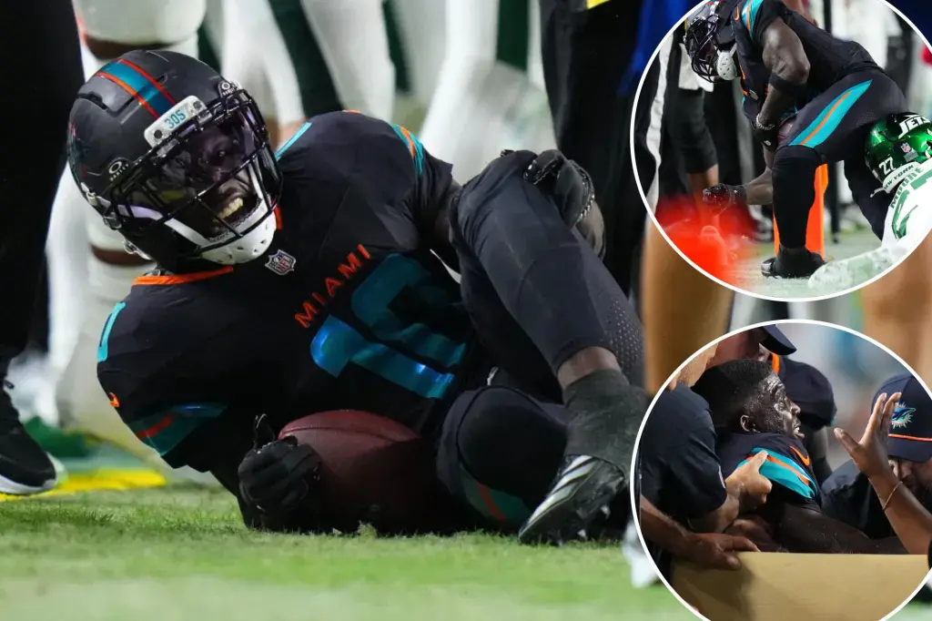 Tyreek Hill of the Dolphins taken off the field after serious leg injury against the Jets