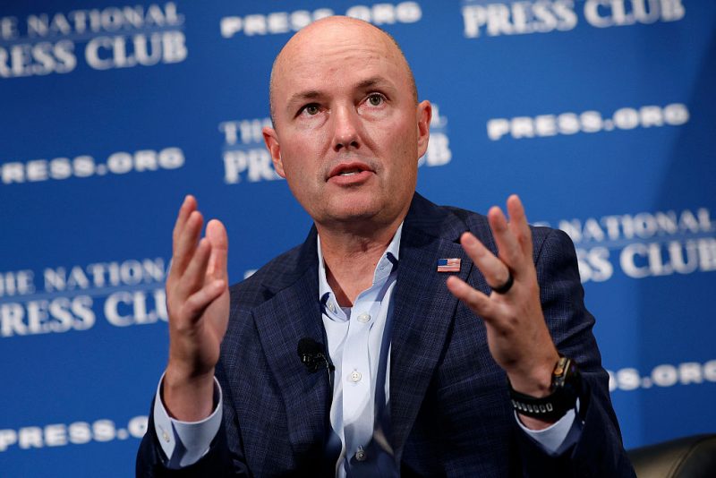 Utah Governor Cox describes Kirk's death as a 'political assassination' and confirms that a 'person of interest' is in custody.