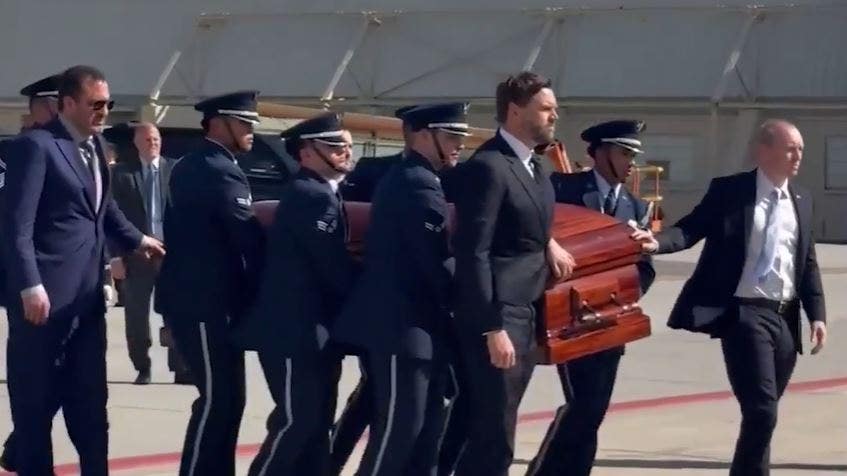 Vice President Vance walks beside Kirk's casket prior to boarding Air Force 2