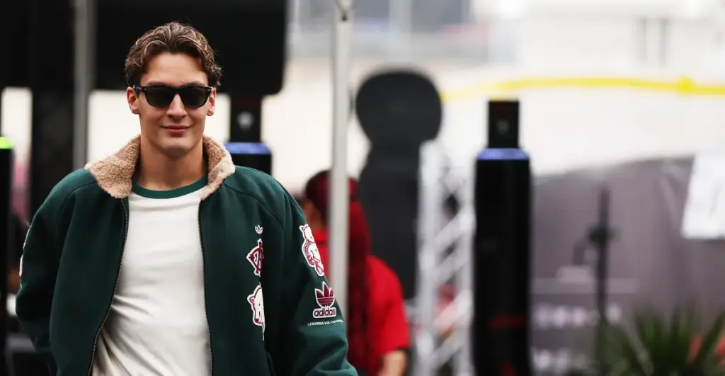 A assured George Russell addresses the press before the USGP