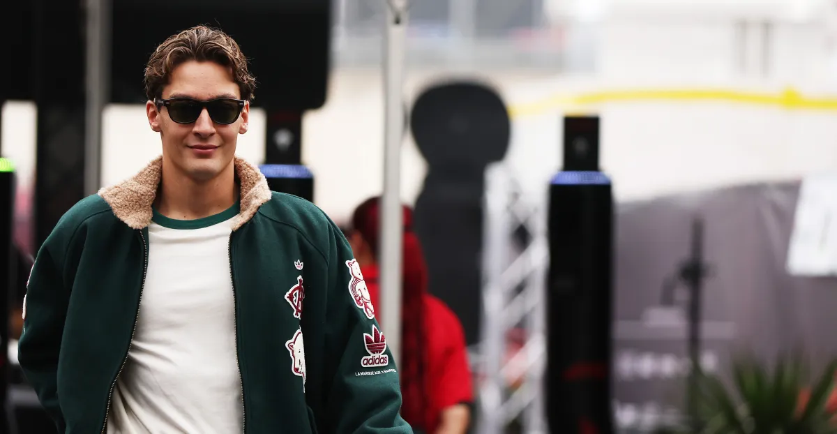 A assured George Russell addresses the press before the USGP