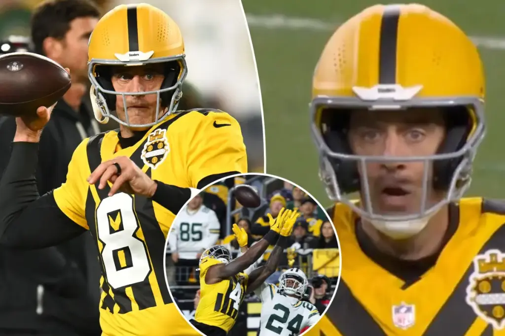 Aaron Rodgers reacts strongly to a dropped pass in the Steelers' loss