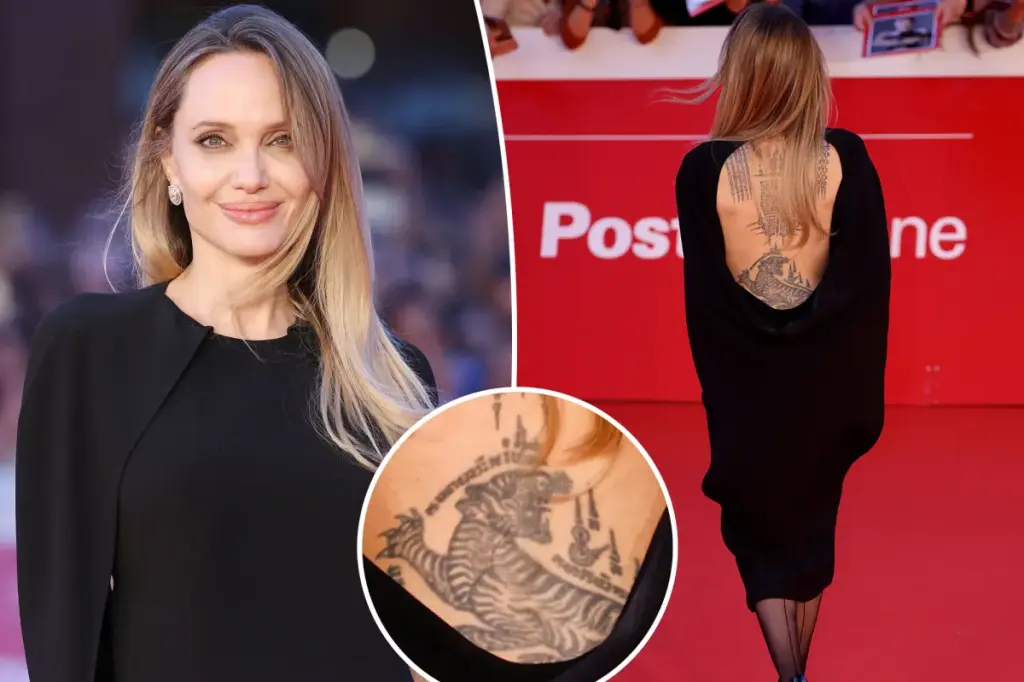 Angelina Jolie showcases her back tattoos in a backless dress at the Rome premiere of 'Couture'