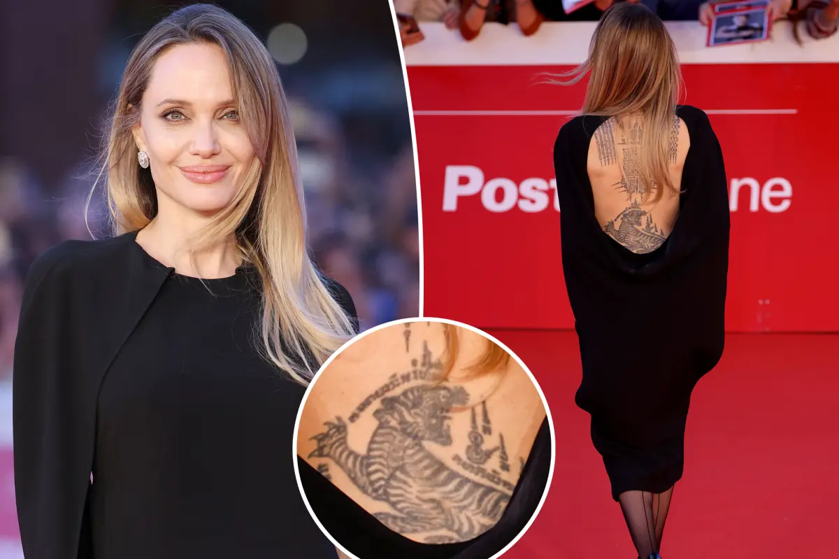 Angelina Jolie showcases her back tattoos in a backless dress at the Rome premiere of 'Couture'