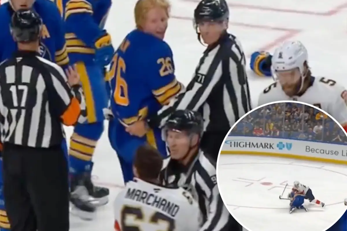 Brad Marchand from the Panthers rips off Rasmus Dahlin's helmet from the Sabres.