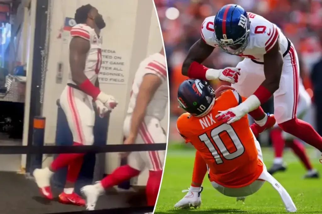 Brian Burns expresses frustration as he heads to the locker room following the Giants' loss