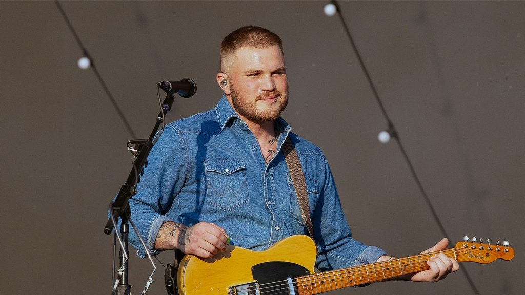 Country musicians criticize Zach Bryan for his controversial song lyrics against ICE.