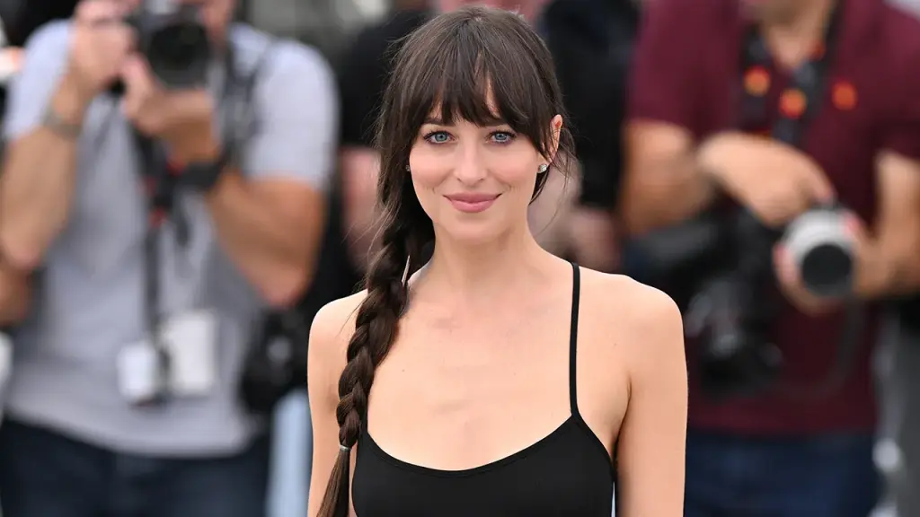 Dakota Johnson stands by her choice to wear revealing dresses on red carpets without any remorse.
