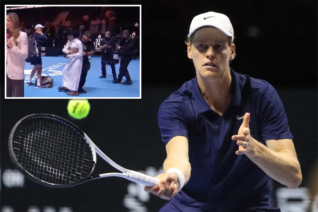 Fan rushes toward Jannik Sinner on the court at Six Kings Slam
