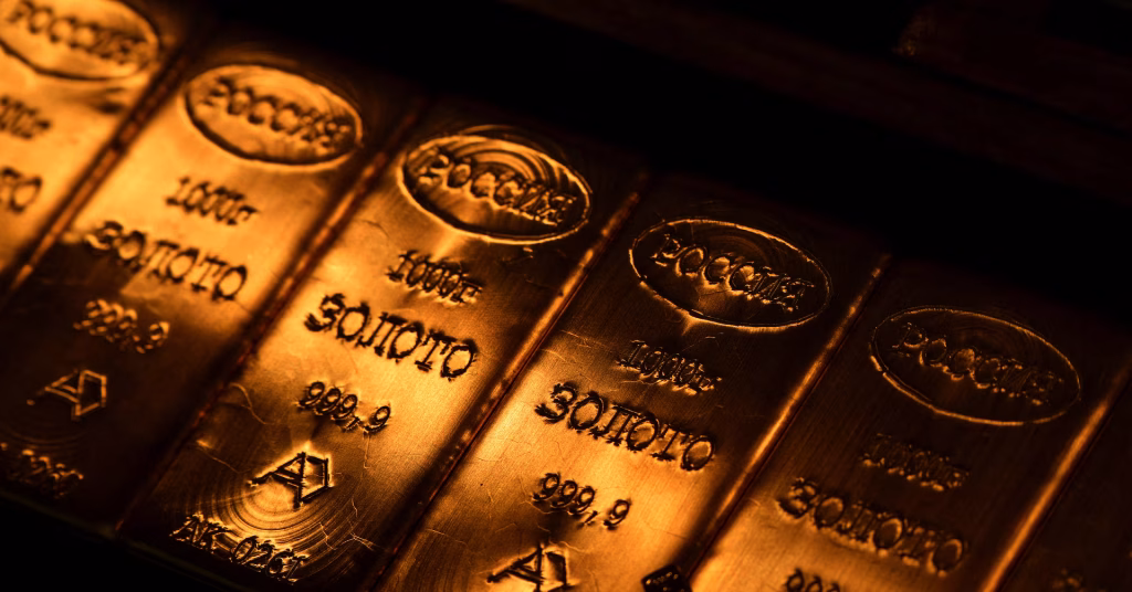 Gold retreats from record peak amid strong dollar and Trump's comments on China.