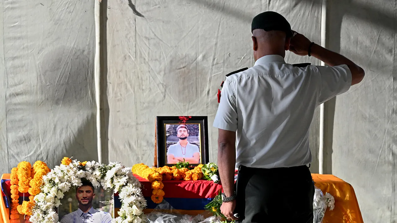 Hamas hands over the coffin of a dead hostage to Red Cross representatives in Gaza