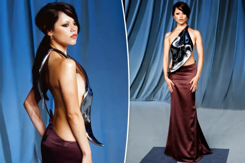 Jenna Ortega showcases a revealing metal breastplate at the Academy Museum Gala 2025