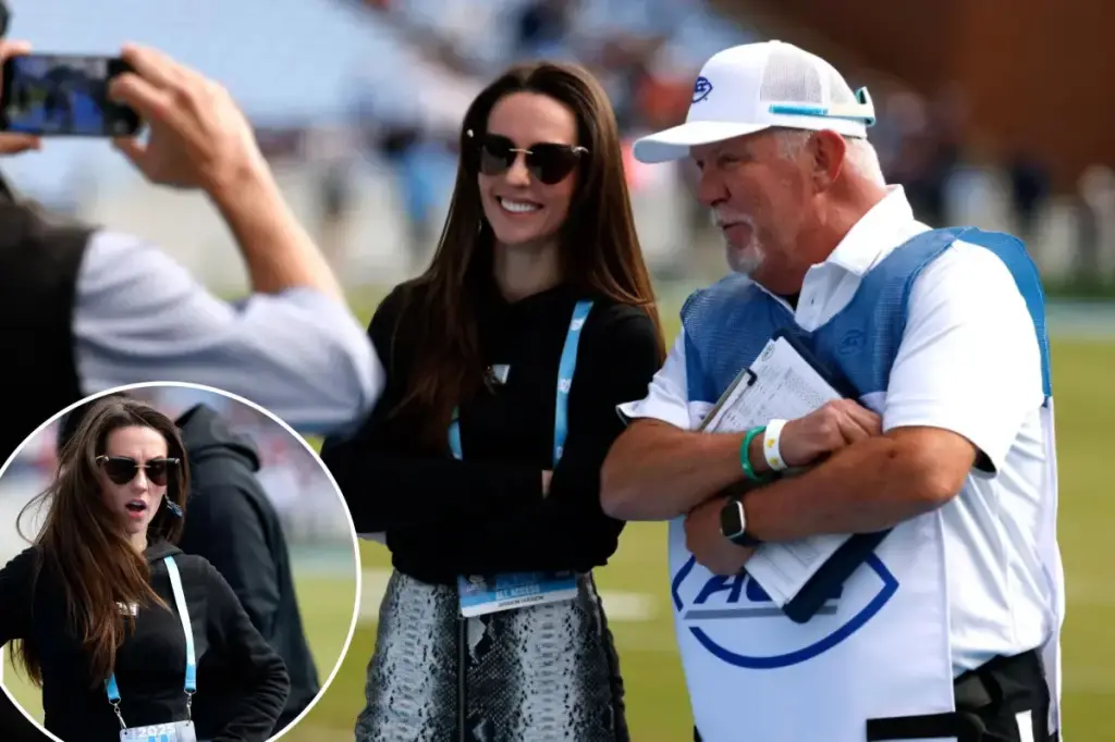 Jordon Hudson takes pictures ahead of North Carolina defeat