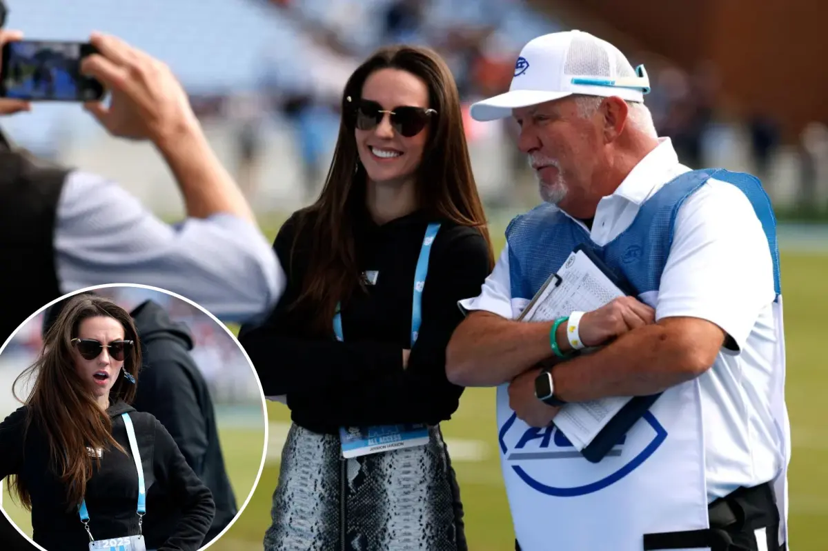 Jordon Hudson takes pictures ahead of North Carolina defeat