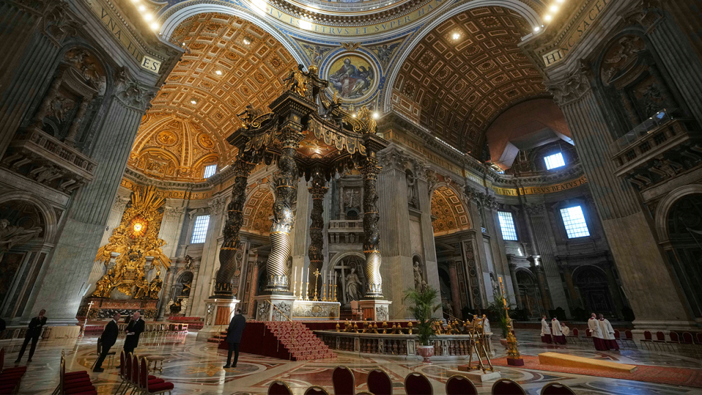 Man interrupts St. Peter's Basilica by climbing the altar before being escorted away by security