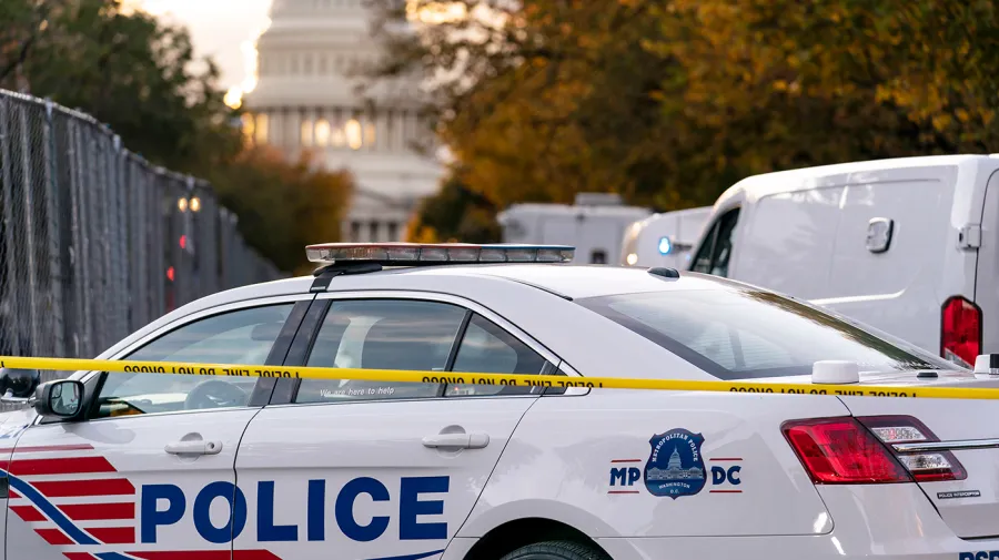 Man taken into custody near Mass celebrating the beginning of Supreme Court term had 200 explosive devices, according to police.
