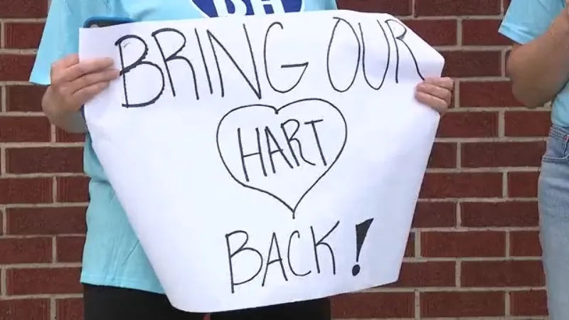 Parents in Kansas claim a teacher was let go for providing 'dignity' to a student with special needs.