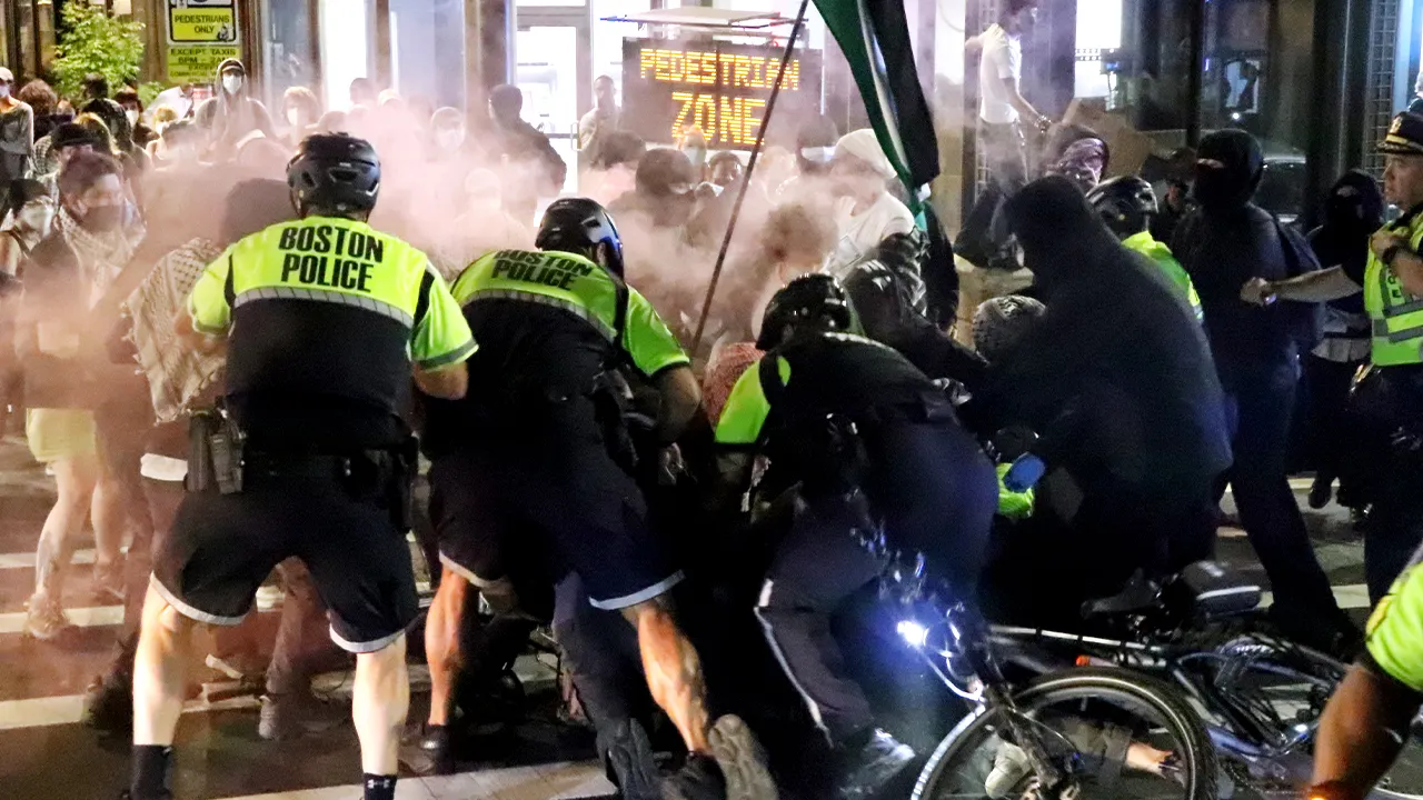 Protesters face disorder charges after violence injures police officers, officials say.