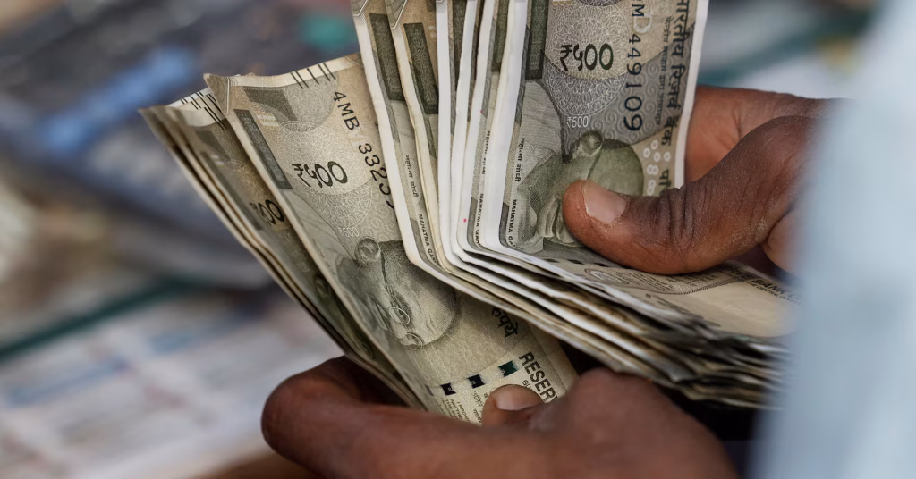 Rupee holds steady, caught between weak risk appetite and expectations of intervention.