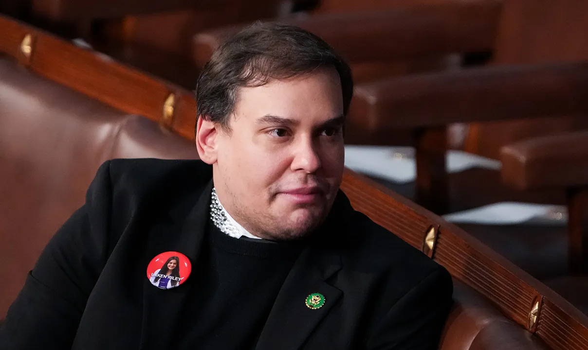 Santos criticizes Biden and responds to a CNN host by claiming Trump treated him well.