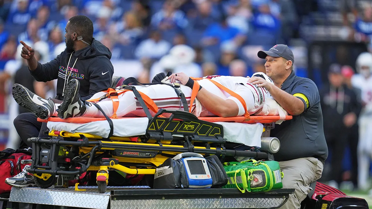 Travis Vokolek leaves the field on a stretcher following a neck injury