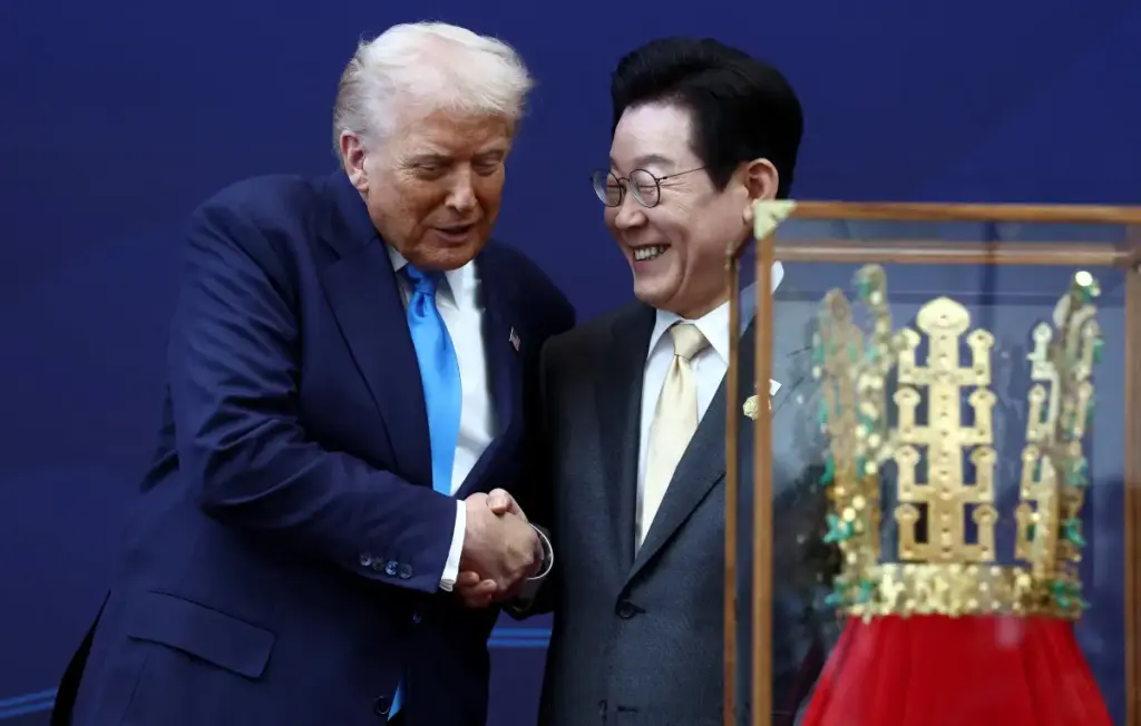Trump receives a large gold crown in South Korea as the host praises his 'golden era'
