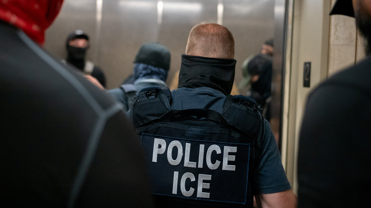 Two men are charged with federal offenses for online threats against an ICE officer and his wife.