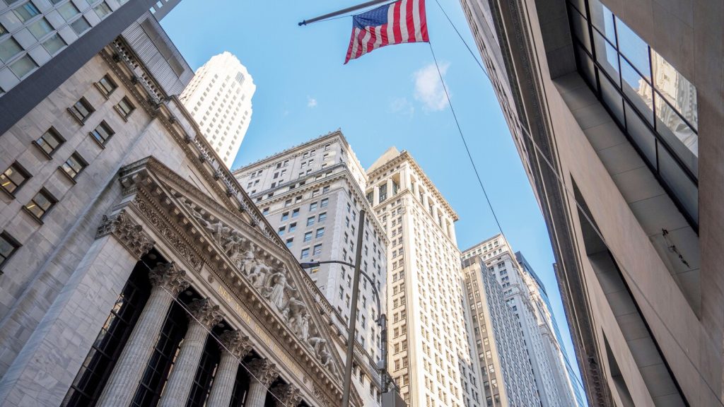 US stocks hover near record highs as technology continues to climb and Wall Street overlooks the government shutdown.