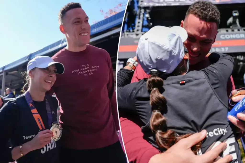 Aaron Judge embraces his wife Samantha following the 2025 NYC Marathon