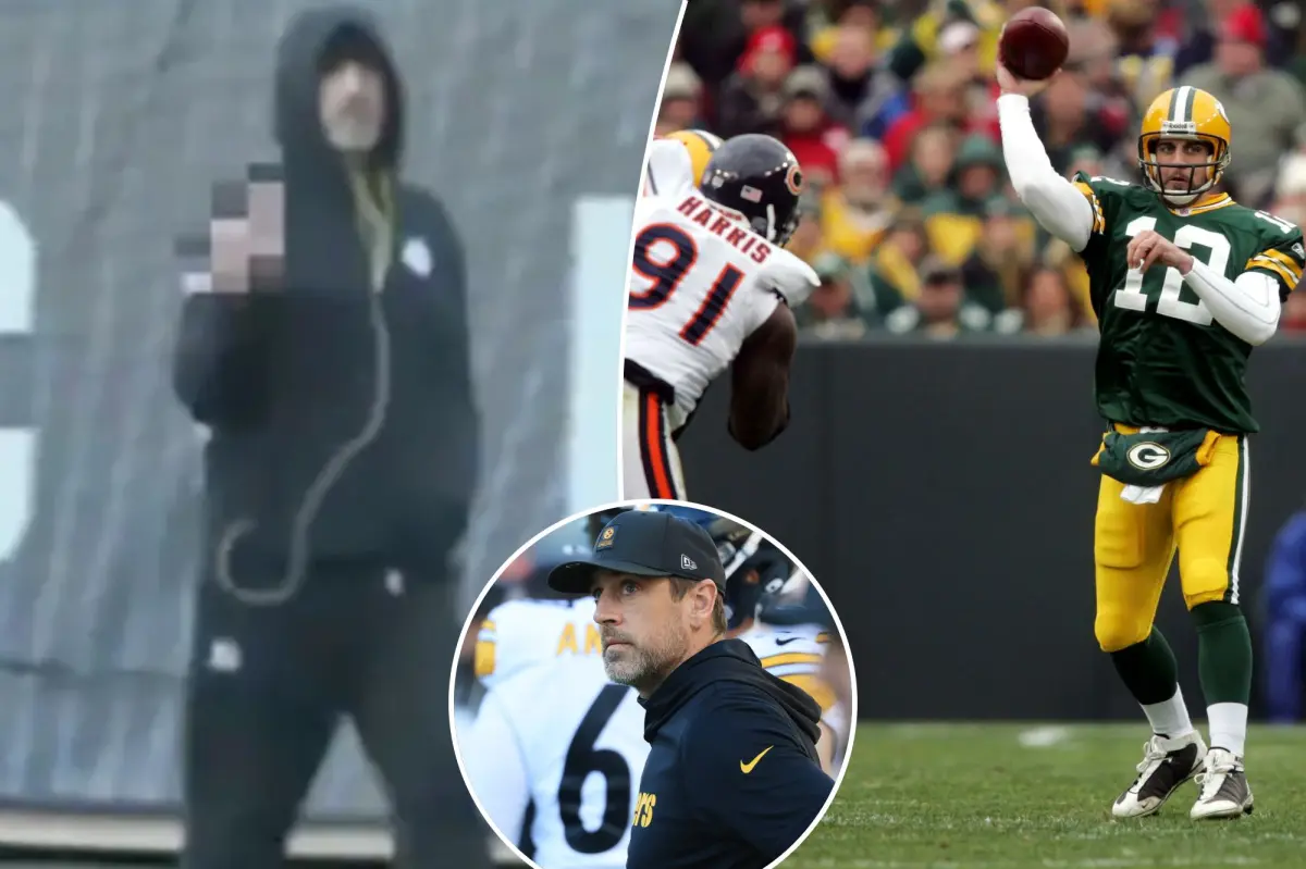 Aaron Rodgers gestures at the camera before missing the Steelers-Bears game