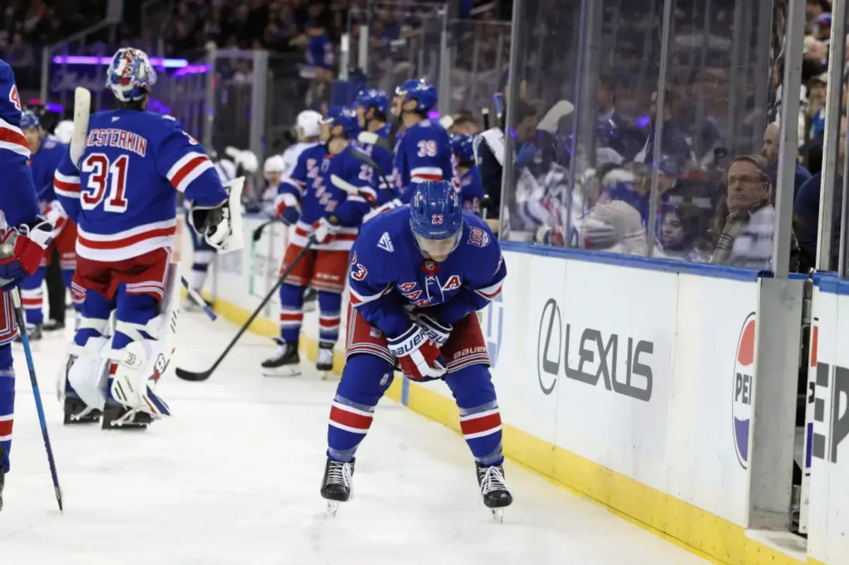 Adam Fox exited the game due to a noticeable arm injury in a troubling moment for the Rangers.