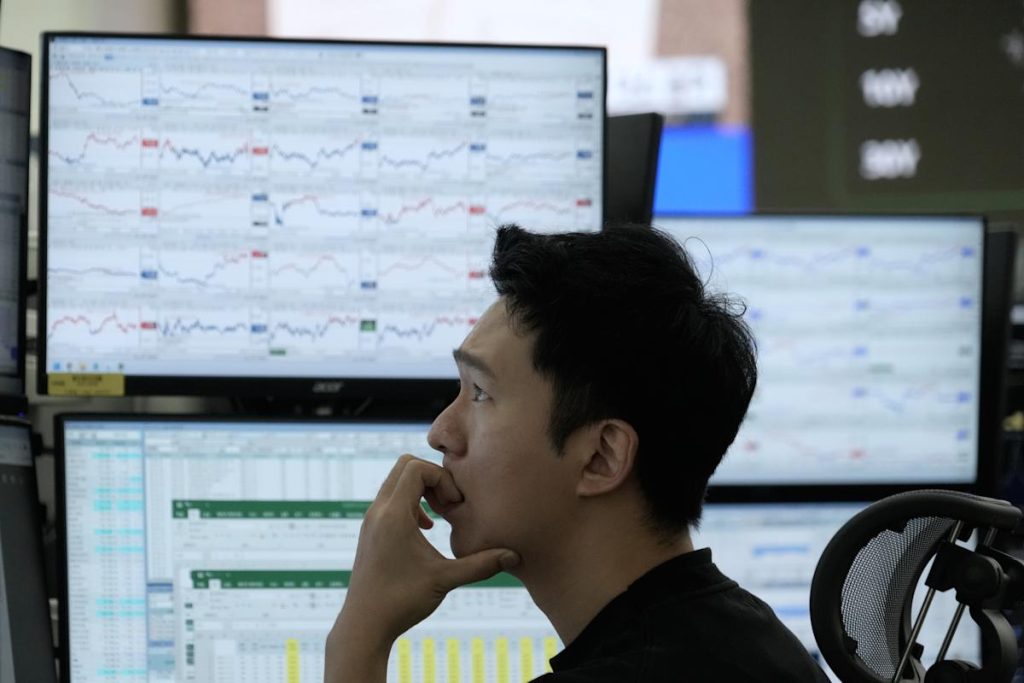 Asian stocks decline, following Wall Street's drop amid concerns about AI shares and interest rates.