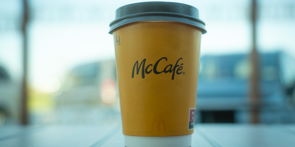 Disturbed woman charged with throwing hot coffee at McDonald's manager makes first court appearance.