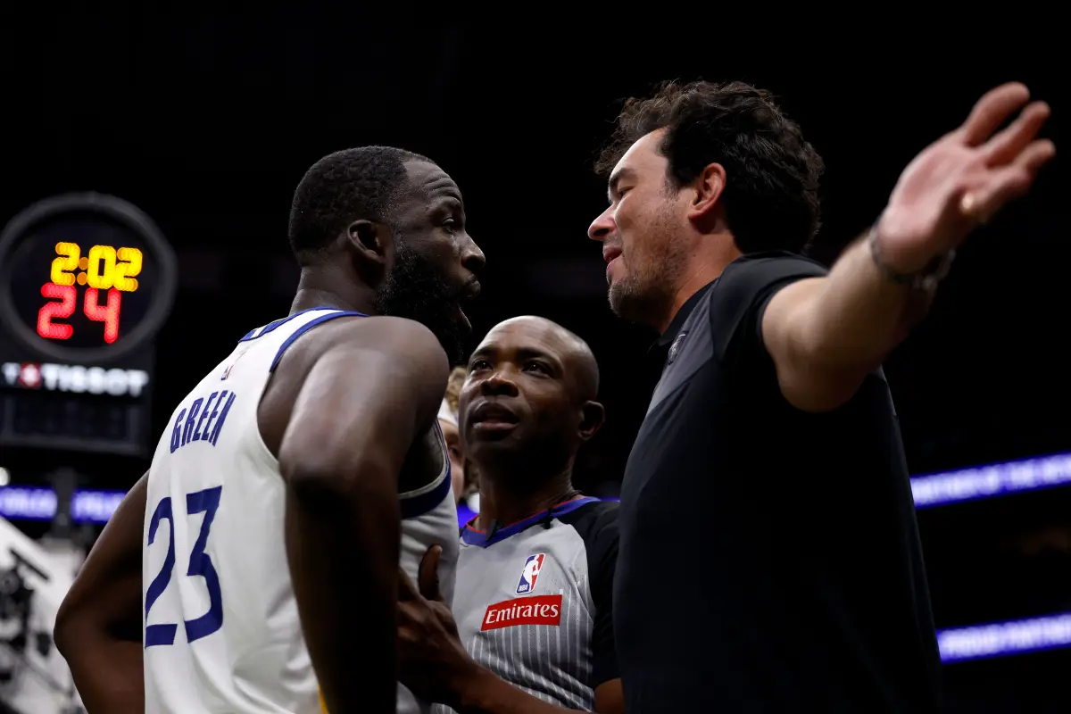 Draymond Green faces off with a Pelicans fan, reportedly threatening to punch him after 'Angel Reese' remarks.